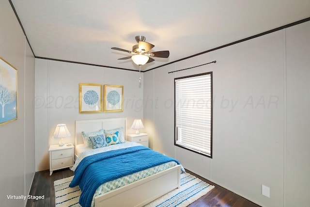 707 Trice St, Claude, TX 79019 - bedroom featuring crown molding, dark wood-style flooring, and a ceiling fan