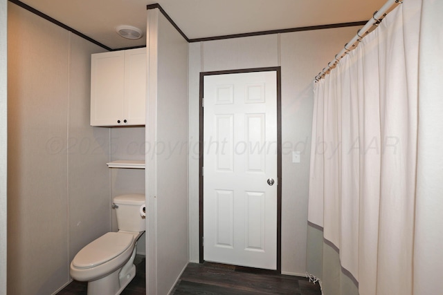 707 Trice St, Claude, TX 79019 - bathroom with toilet and wood finished floors