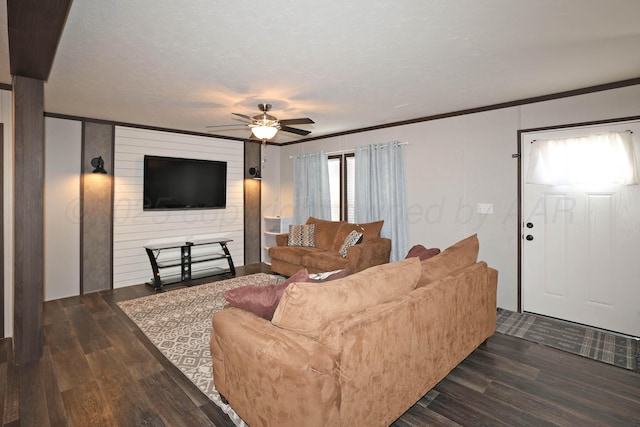 707 Trice St, Claude, TX 79019 - living area with a ceiling fan, ornamental molding, and dark wood-style floors