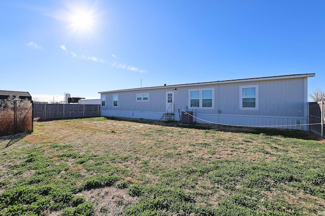 707 Trice St, Claude, TX 79019 - rear view of house featuring a yard, a fenced backyard, and cooling unit