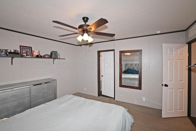707 Trice St, Claude, TX 79019 - bedroom with crown molding, a ceiling fan, and carpet floors