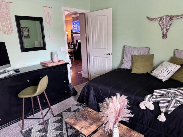 bedroom with hardwood / wood-style flooring