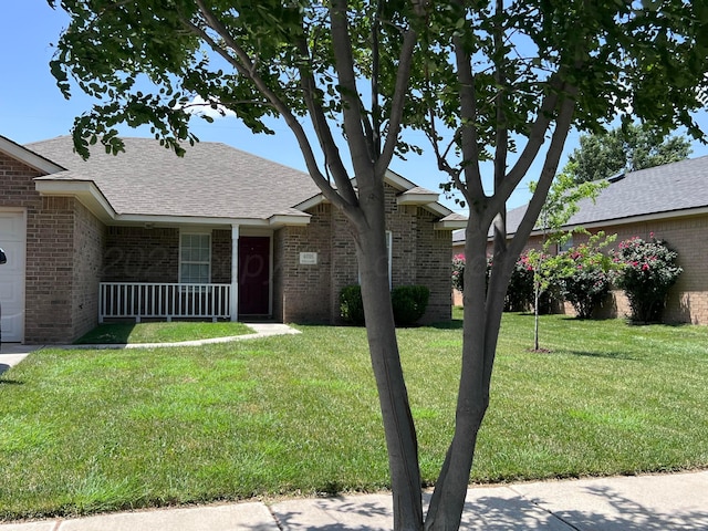 4016 S Williams St, Amarillo, TX 79118 - ranch-style house featuring brick siding, a front yard, and a porch