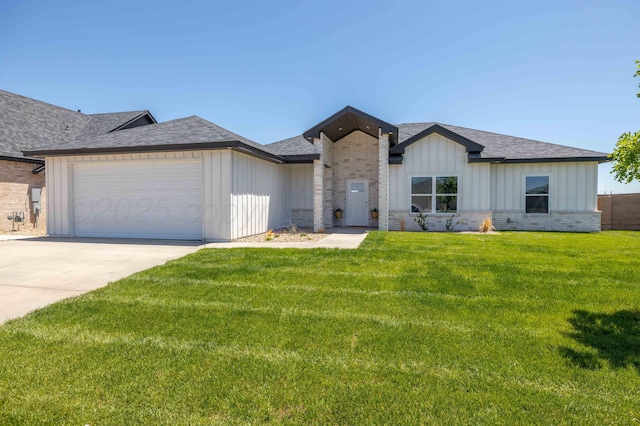 4108 Inez Way, Amarillo, TX 79124 - view of front of house with board and batten siding, a garage, a front lawn, driveway, and roof with shingles