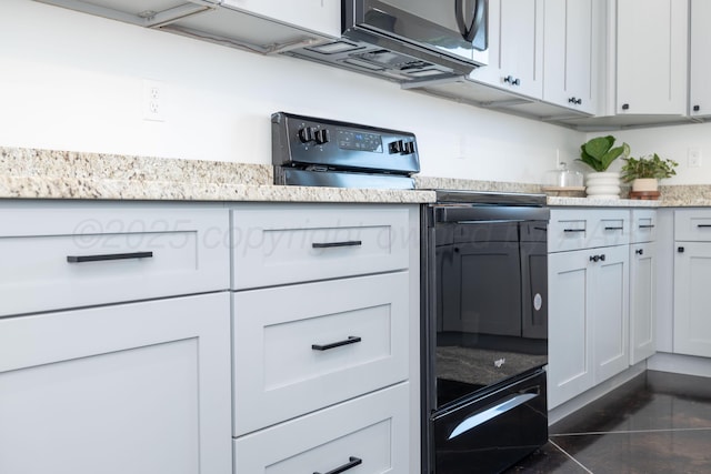 4108 Inez Way, Amarillo, TX 79124 - kitchen featuring black range with electric cooktop, stainless steel microwave, and light stone counters