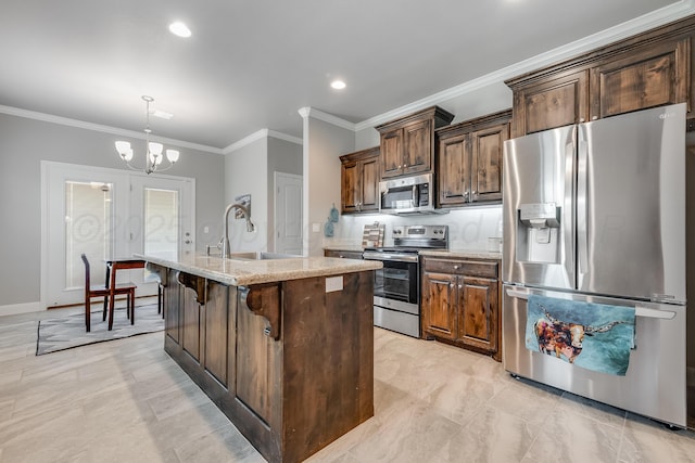 5013 Gloster St, Amarillo, TX 79118 - kitchen with stainless steel appliances, ornamental molding, a chandelier, a kitchen island with sink, and light stone countertops