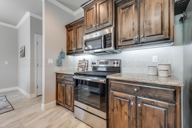 5013 Gloster St, Amarillo, TX 79118 - kitchen featuring stainless steel appliances, crown molding, light stone counters, and dark brown cabinets