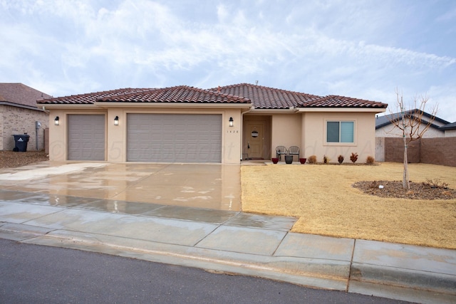 mediterranean / spanish-style home featuring a garage