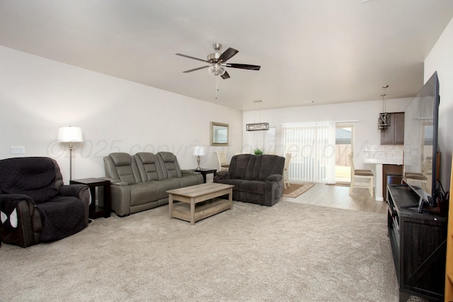 carpeted living room featuring ceiling fan