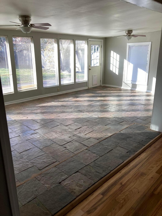 3706 Lenwood Dr, Amarillo, TX 79109 - unfurnished living room featuring a ceiling fan and baseboards