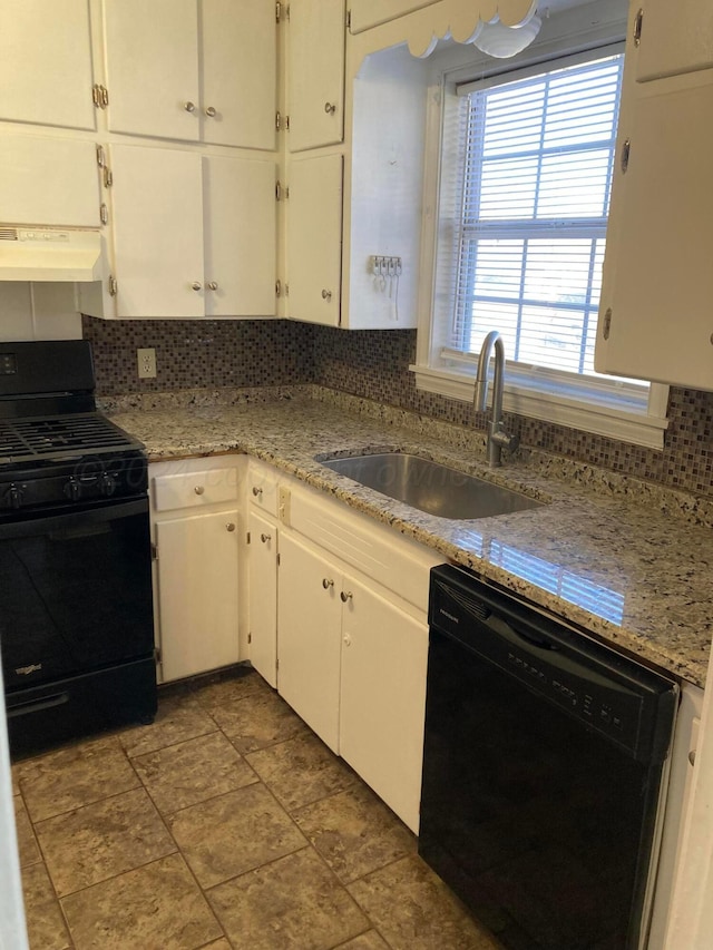 3706 Lenwood Dr, Amarillo, TX 79109 - kitchen featuring black appliances, a sink, under cabinet range hood, backsplash, and white cabinetry