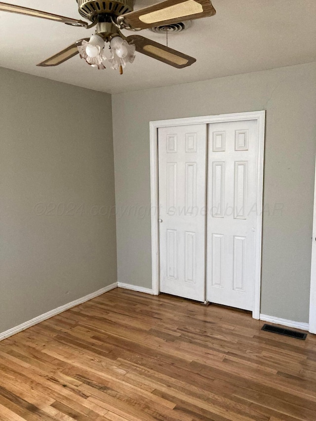 3706 Lenwood Dr, Amarillo, TX 79109 - unfurnished bedroom featuring wood finished floors, baseboards, and a closet