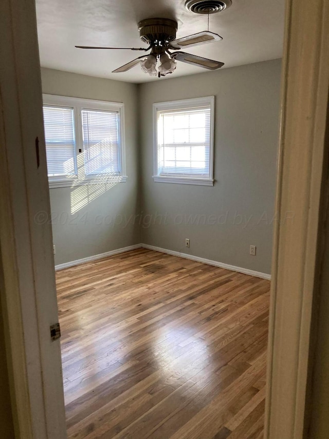 3706 Lenwood Dr, Amarillo, TX 79109 - unfurnished room with a ceiling fan, wood finished floors, and baseboards