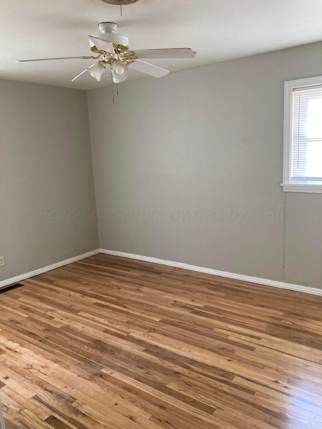 3706 Lenwood Dr, Amarillo, TX 79109 - empty room featuring wood finished floors, baseboards, and a ceiling fan