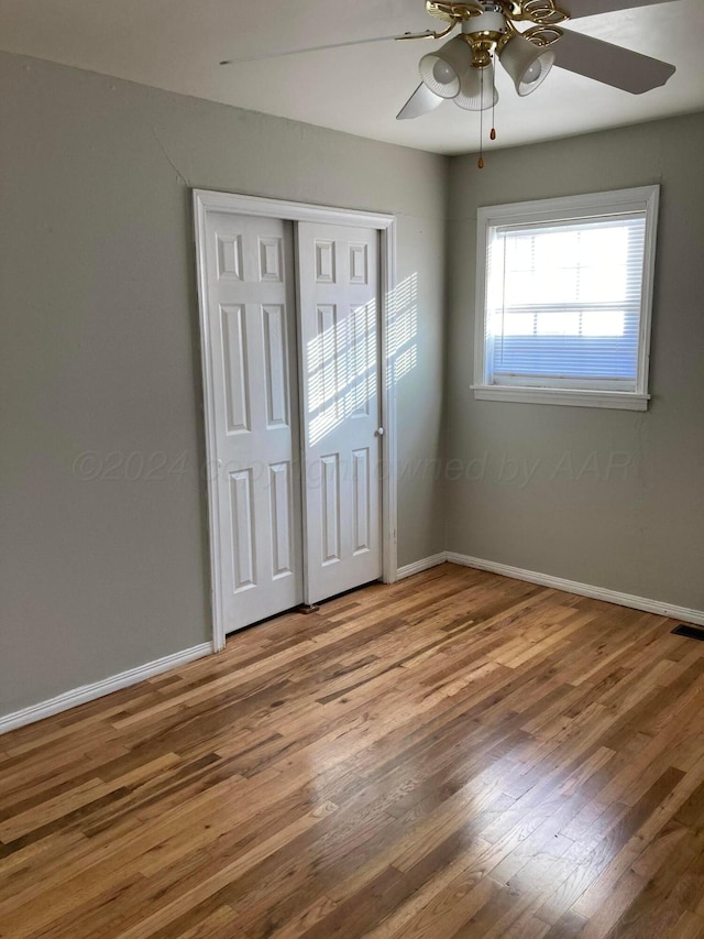 3706 Lenwood Dr, Amarillo, TX 79109 - unfurnished bedroom featuring wood finished floors, baseboards, a closet, and a ceiling fan