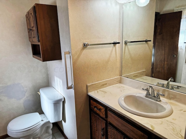 106 Middle St, Balko, OK 73931 - bathroom featuring vanity, tile patterned flooring, and toilet