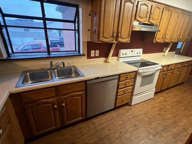 kitchen featuring dark wood-type flooring, stainless steel dishwasher, sink, and white range with electric cooktop