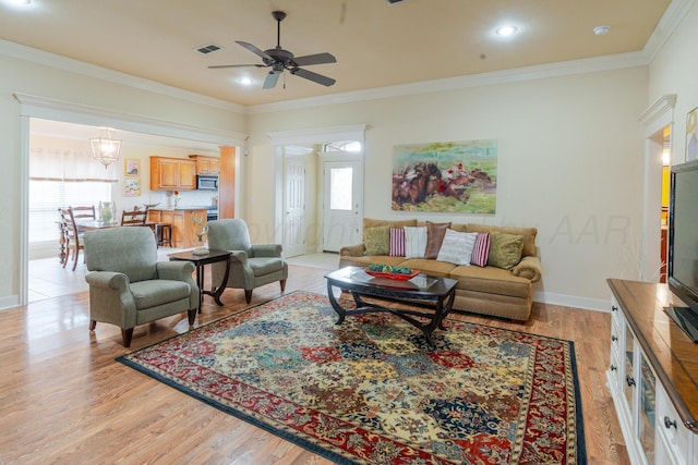 8301 El Paso Dr, Amarillo, TX 79118 - living area with light wood finished floors, a ceiling fan, ornamental molding, and recessed lighting