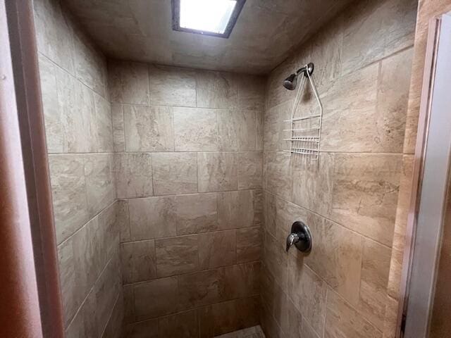 bathroom with tiled shower