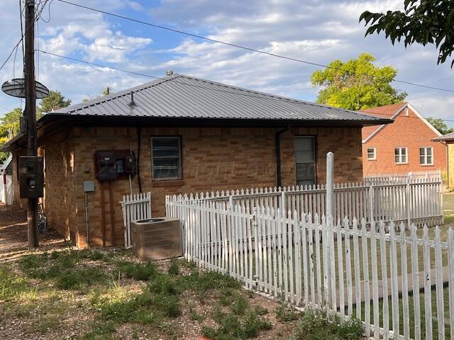 view of home's exterior with central AC unit