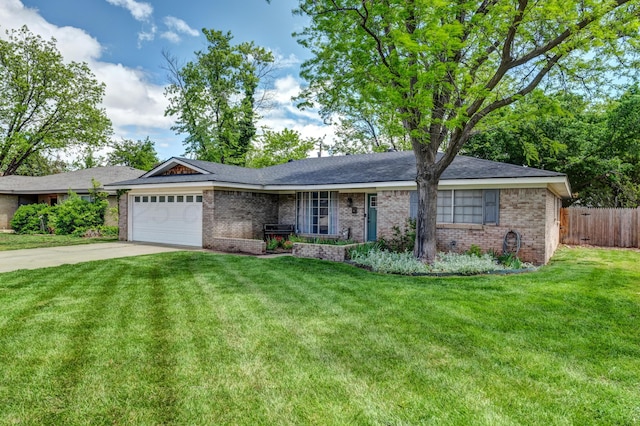 3409 Harmony St, Amarillo, TX 79109 - ranch-style house with concrete driveway, an attached garage, and brick siding