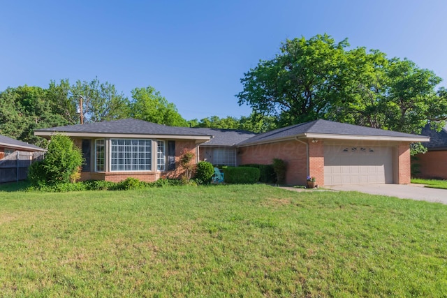 ranch-style home featuring brick siding, a garage, and concrete driveway