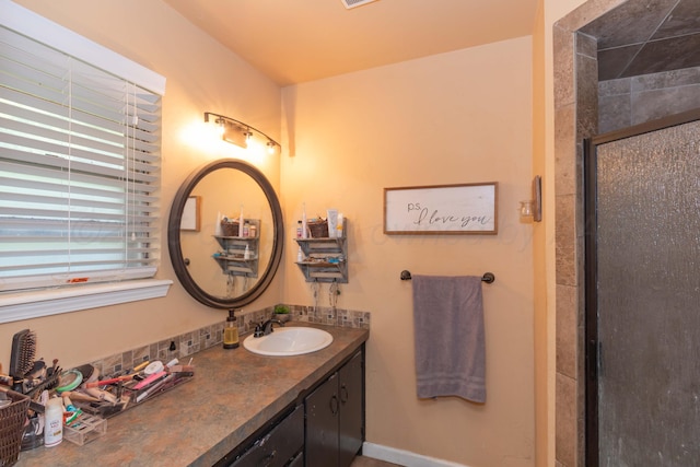 full bathroom with a stall shower and vanity