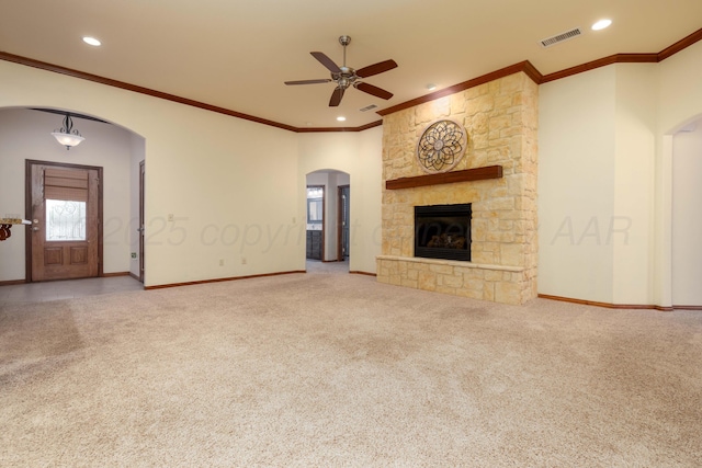 8102 Little Rock Dr, Amarillo, TX 79118 - unfurnished living room with arched walkways, carpet floors, ceiling fan, crown molding, and a fireplace