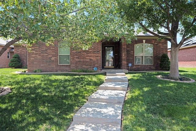 8102 Little Rock Dr, Amarillo, TX 79118 - view of front of home with a front lawn and brick siding