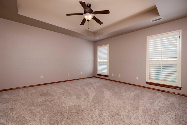 8102 Little Rock Dr, Amarillo, TX 79118 - spare room featuring a tray ceiling, carpet flooring, and ceiling fan