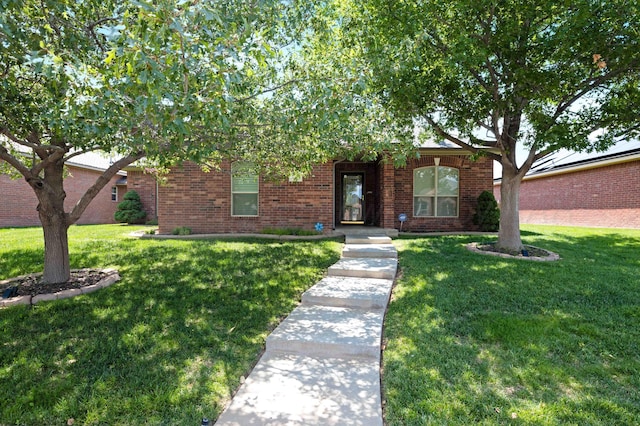 8102 Little Rock Dr, Amarillo, TX 79118 - view of front of property featuring a front lawn and brick siding