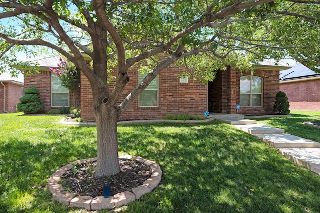 8102 Little Rock Dr, Amarillo, TX 79118 - view of front facade featuring a front lawn and brick siding