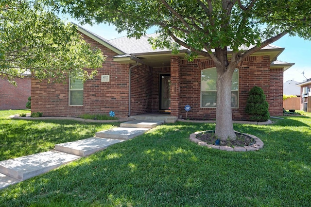 8102 Little Rock Dr, Amarillo, TX 79118 - ranch-style home with a front lawn and brick siding