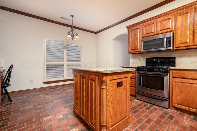 8102 Little Rock Dr, Amarillo, TX 79118 - kitchen with stainless steel appliances, brick flooring, a kitchen island, backsplash, and ornamental molding