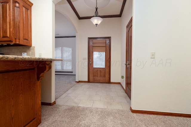 8102 Little Rock Dr, Amarillo, TX 79118 - entrance foyer featuring light colored carpet, arched walkways, ornamental molding, and light tile patterned floors