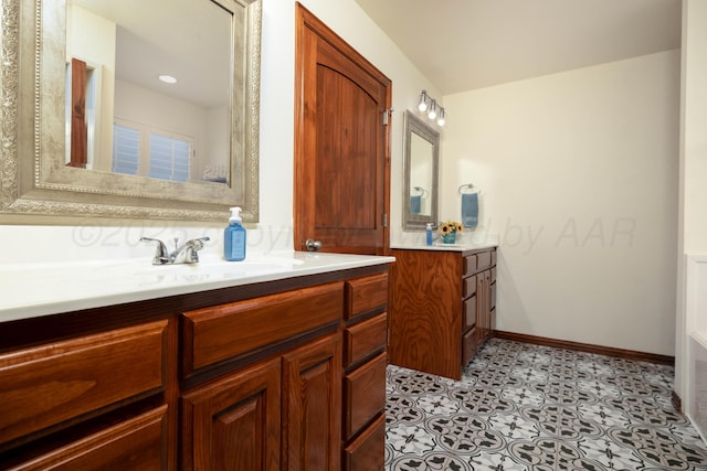 8102 Little Rock Dr, Amarillo, TX 79118 - bathroom with two vanities and baseboards