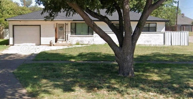 single story home with a front yard, an attached garage, fence, and concrete driveway