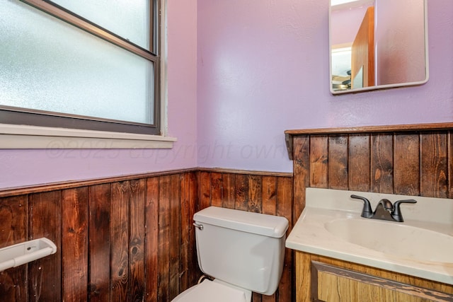 3110 S Apache St, Amarillo, TX 79103 - half bath featuring wainscoting, vanity, and wood walls