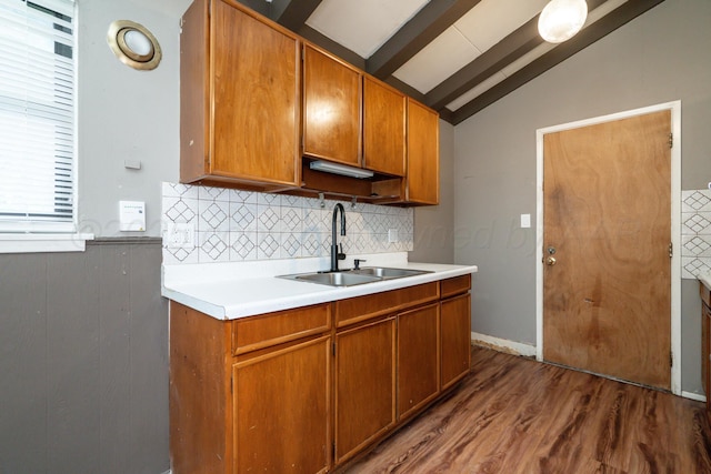 3110 S Apache St, Amarillo, TX 79103 - kitchen with decorative backsplash, brown cabinetry, wood finished floors, and light countertops