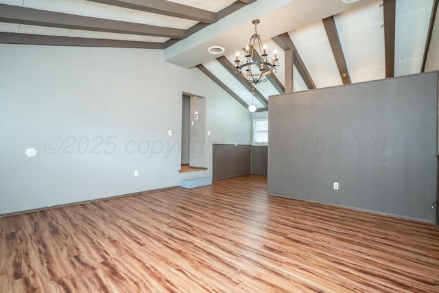 3110 S Apache St, Amarillo, TX 79103 - unfurnished living room with wood finished floors and a chandelier