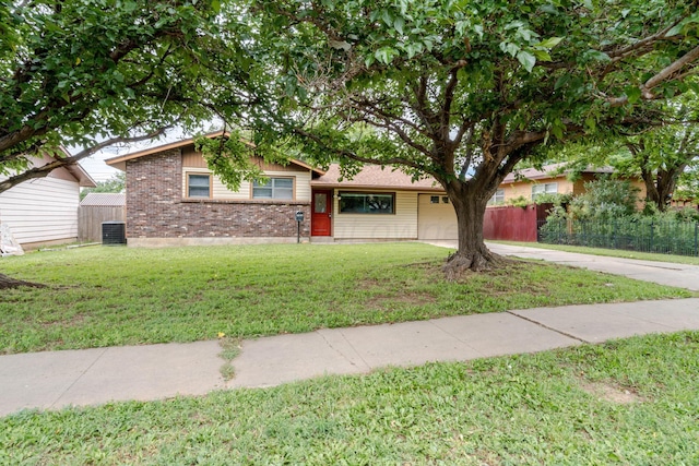 3110 S Apache St, Amarillo, TX 79103 - split level home with driveway, brick siding, and a garage