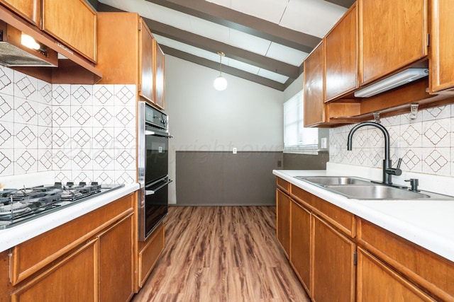 3110 S Apache St, Amarillo, TX 79103 - kitchen featuring stainless steel gas stovetop, backsplash, light countertops, and light wood-style floors