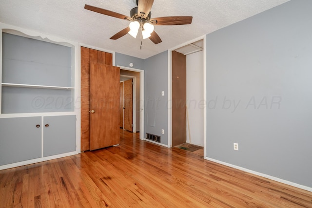 3110 S Apache St, Amarillo, TX 79103 - unfurnished bedroom featuring wood finished floors, a textured ceiling, and ceiling fan
