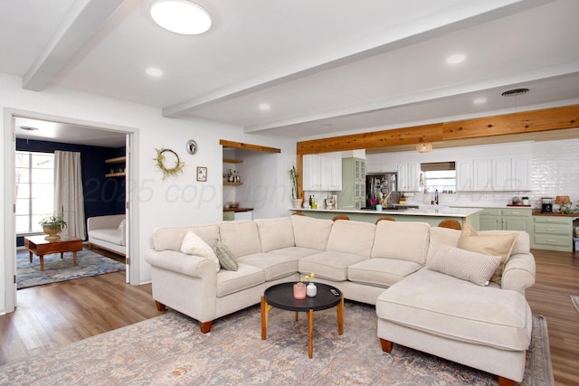 3509 Huntington Dr, Amarillo, TX 79109 - living room with beamed ceiling, wood finished floors, healthy amount of natural light, and recessed lighting