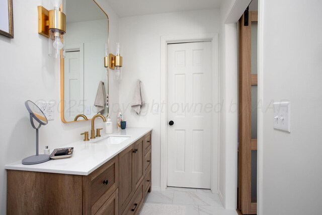 3509 Huntington Dr, Amarillo, TX 79109 - bathroom featuring vanity and marble finish floors