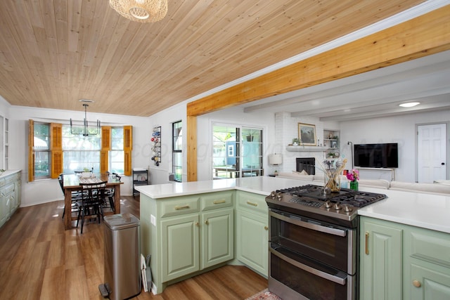 3509 Huntington Dr, Amarillo, TX 79109 - kitchen with range with two ovens, green cabinets, a chandelier, wood ceiling, and a fireplace