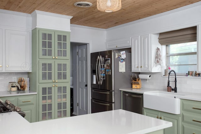 3509 Huntington Dr, Amarillo, TX 79109 - kitchen featuring stainless steel appliances, green cabinets, crown molding, backsplash, and wooden ceiling