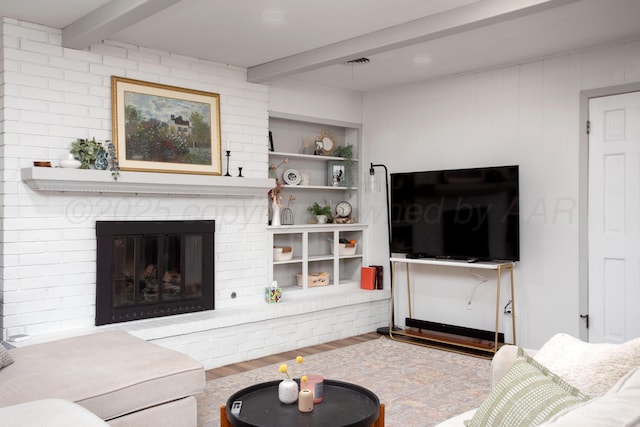 3509 Huntington Dr, Amarillo, TX 79109 - living area featuring beam ceiling, wood finished floors, and a fireplace