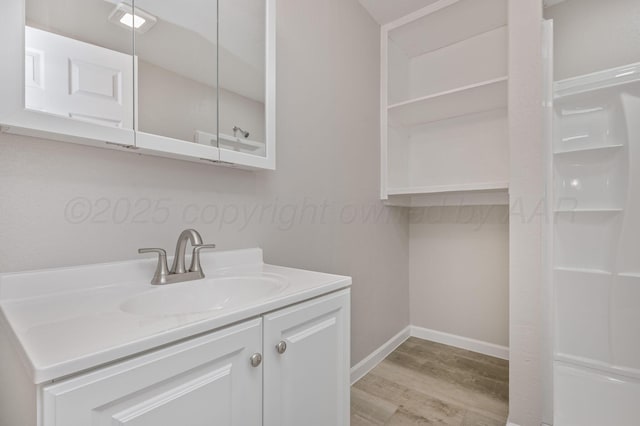 918 N Gray St, Amarillo, TX 79065 - bathroom with wood finished floors and vanity