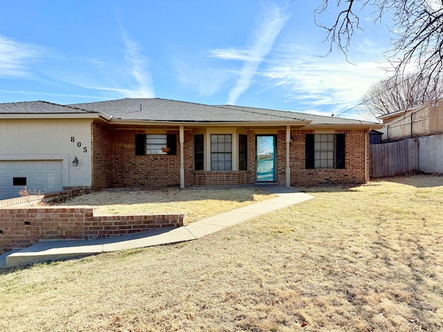 single story home featuring brick siding, a front lawn, an attached garage, and fence